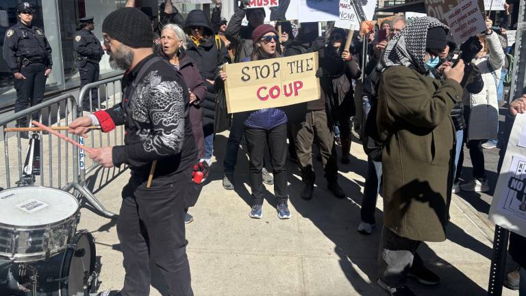 The protest came with musical accompaniment as one rally-goer set up a snare drum to set a beat for the anti-Elon Musk chants.