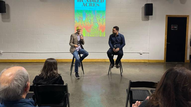 Filmmaker Jamie Fitzpatrick (left) and author Andrew Serra (right) at the book launch party for the novel <i>Hell’s Hundred Acres,</i> held at the community space DCTV, which is in the historic building that once housed FDNY Engine 31 on Lafayette Street.