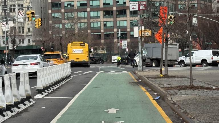 Near the intersection of 6th Avenue and Canal Street, broader and more protected lanes have been put in place by the NYC Department of Transportation.