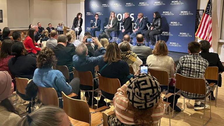 Maud Maron, a member of the Community Education Council in Manhattan’s District 2, was reinstated to her post by a federal judge on Sept. 3 after city officials previously removed her for allegedly violating city regulations governing the conduct of parent leaders. Here, Maron sits on stage at an event hosted by the right-wing group Moms for Liberty.